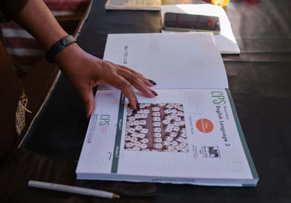 Cynthia reading a donated book