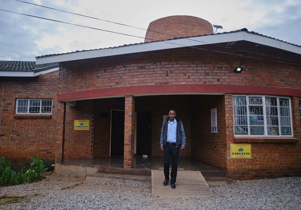Timothy outside the Edward Ndlovu Memorial Library
